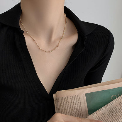 Golden Bead Charm Necklace