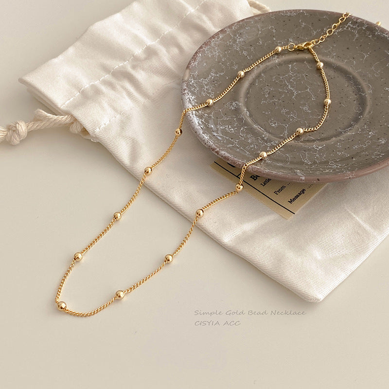 Golden Bead Charm Necklace